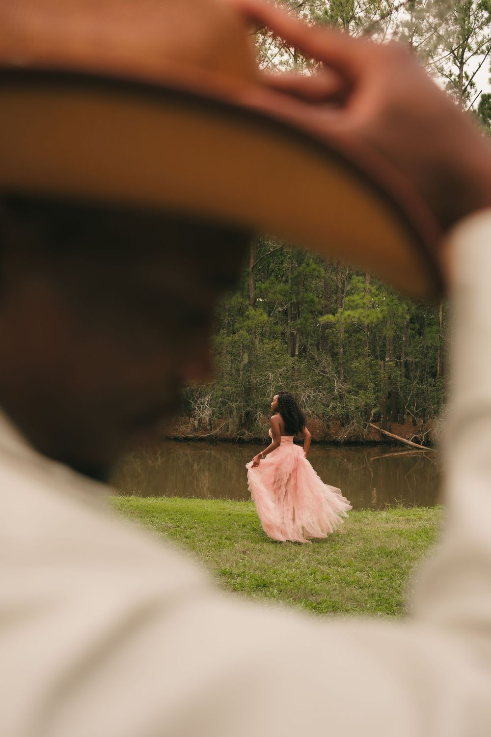 Portrait of couple dressed in Western style clothing at Charleston County Park in Charleston SC