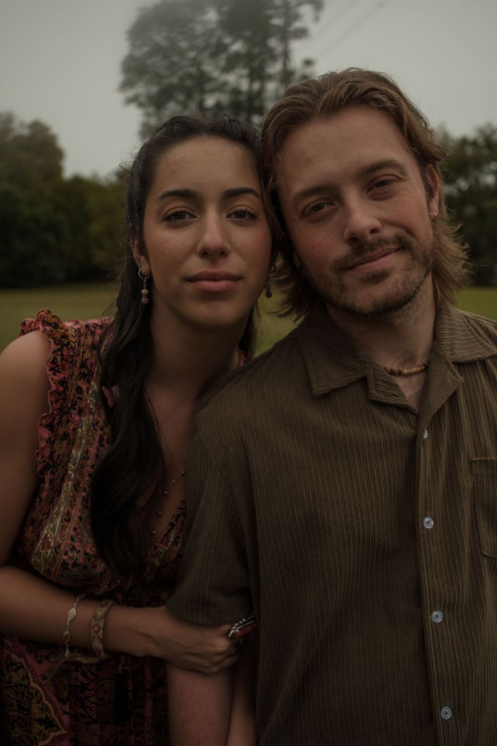 Couple in boho outfits posing together at Hampton Park in Charleston SC