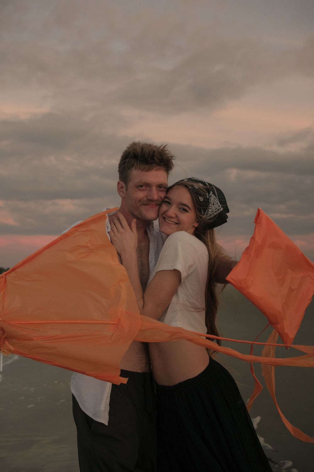 Romantic couples photoshoot on Folly Beach with warm sunset light