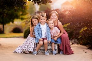 Family group photos taken at golden hour with natural landscape background.