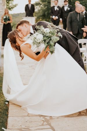 Flowing white wedding dress captured in artistic outdoor photography sequences.