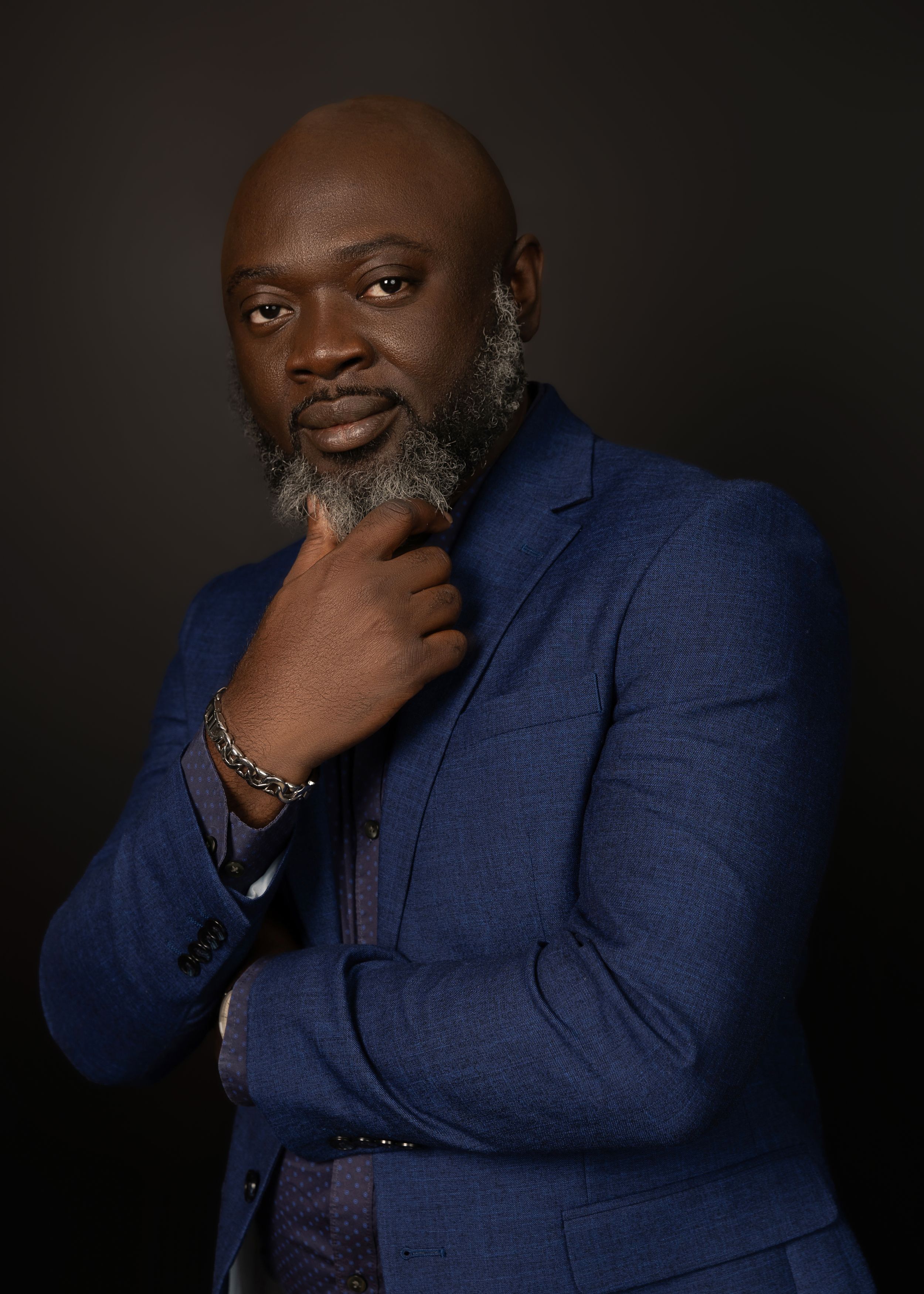 Personal branding photoshoot black african male in blue suit vanessa charlotte photograhy studio