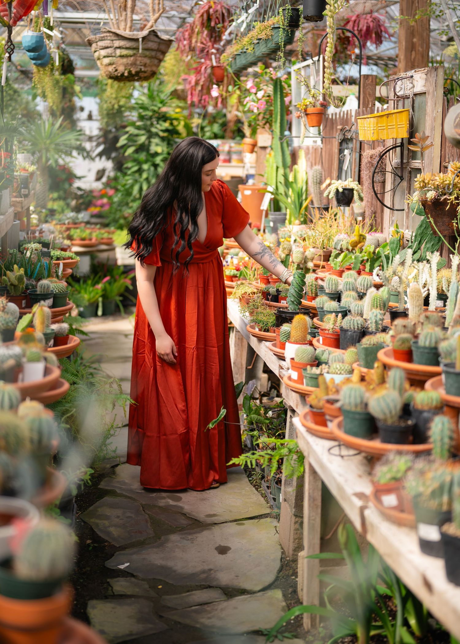 Women looking a cactus while standing in a beautiful greenhouse. Wrightstown NJ Family Photographer