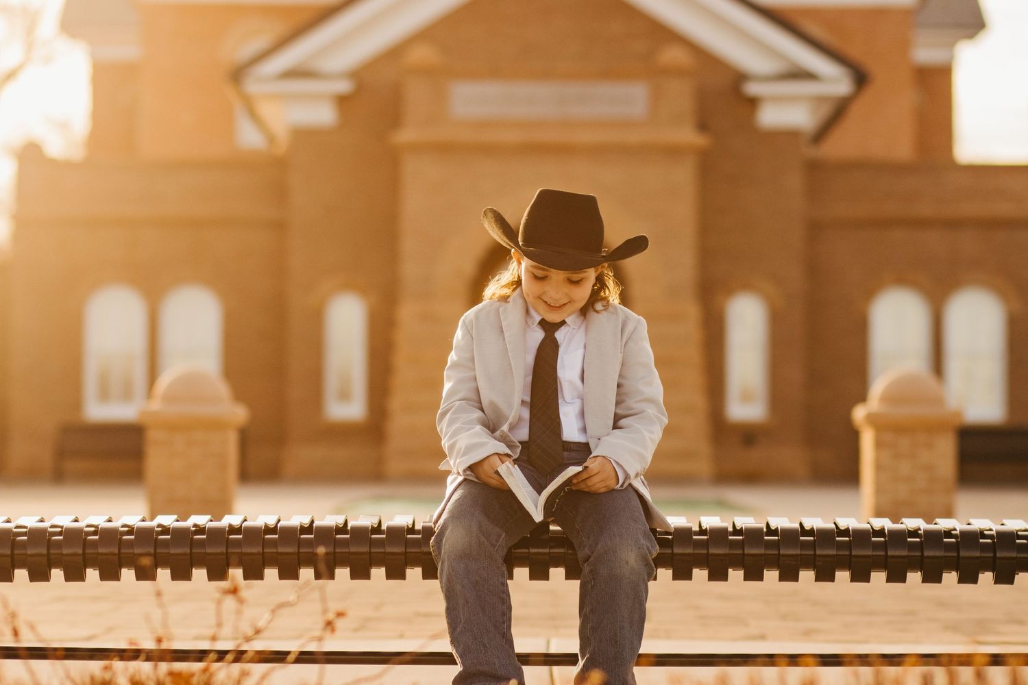 Vernal, Utah LDS Temple as this cowboy is preparing for his baptism. With a gorgeous light haze warming the image.