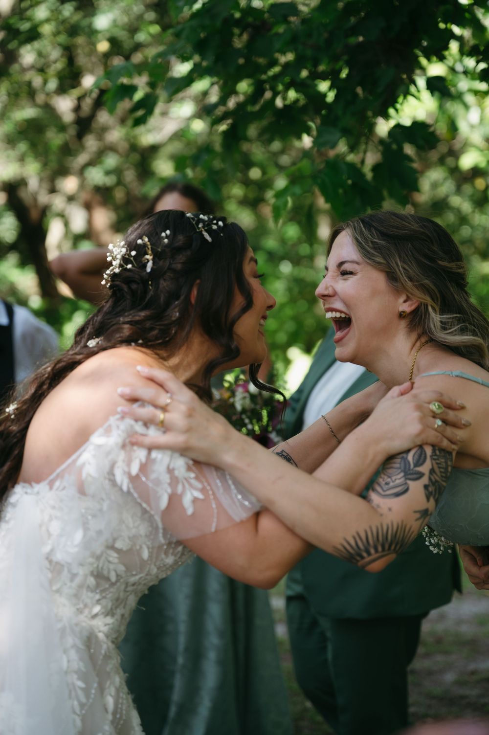 Bride and maid of Honor laughing at Botanical Wedding in Deerfield Florida
