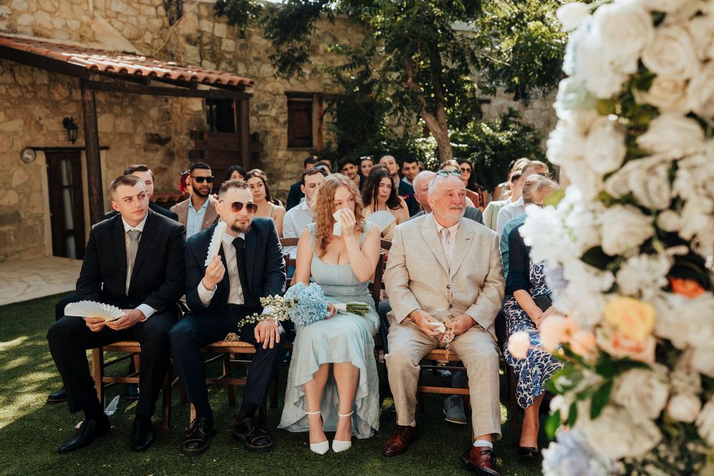 A series of wedding celebration photos showing guests enjoying an outdoor reception with floral decorations.