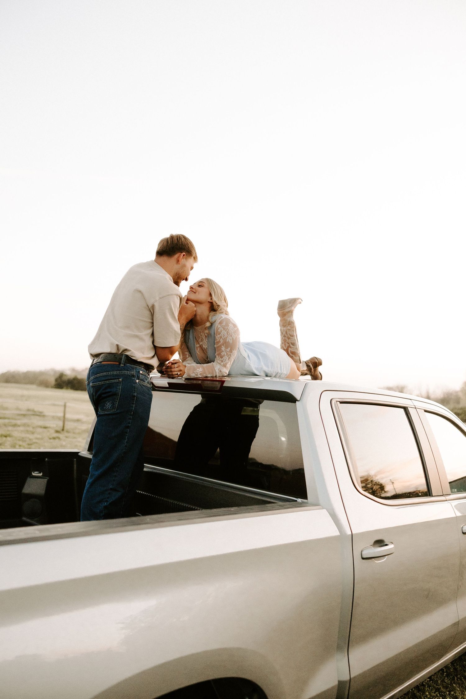 Western couples photoshoot in Gallatin, TN with a focus on cowgirl boots and horses.