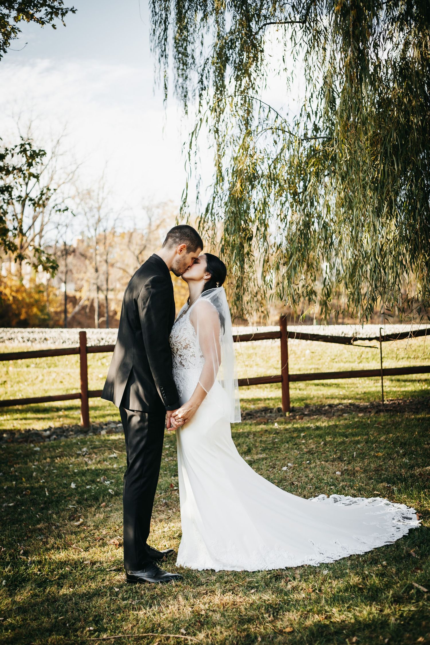 Olivia and Cruise holding hands, face to face on their wedding day at Appalachia Hills in Callaway, Virginia.