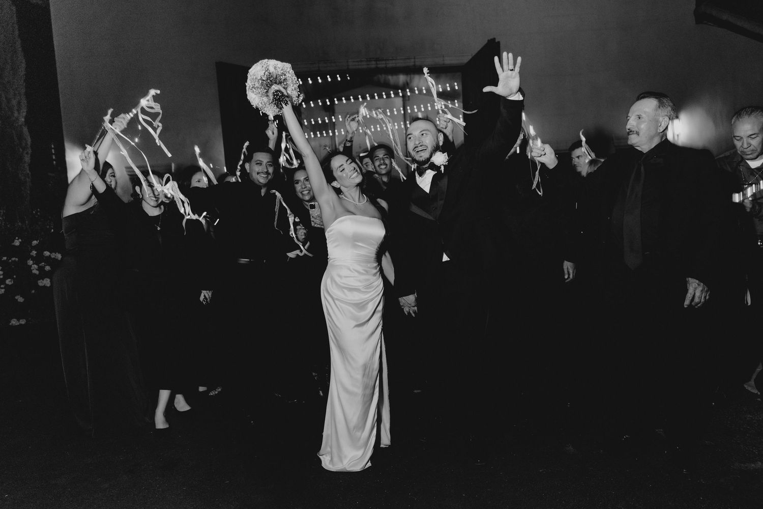 Wedding guests dancing and celebrating in Paso Robles Winery Wedding as the couple leaves for the Night. Fresno California Wedding