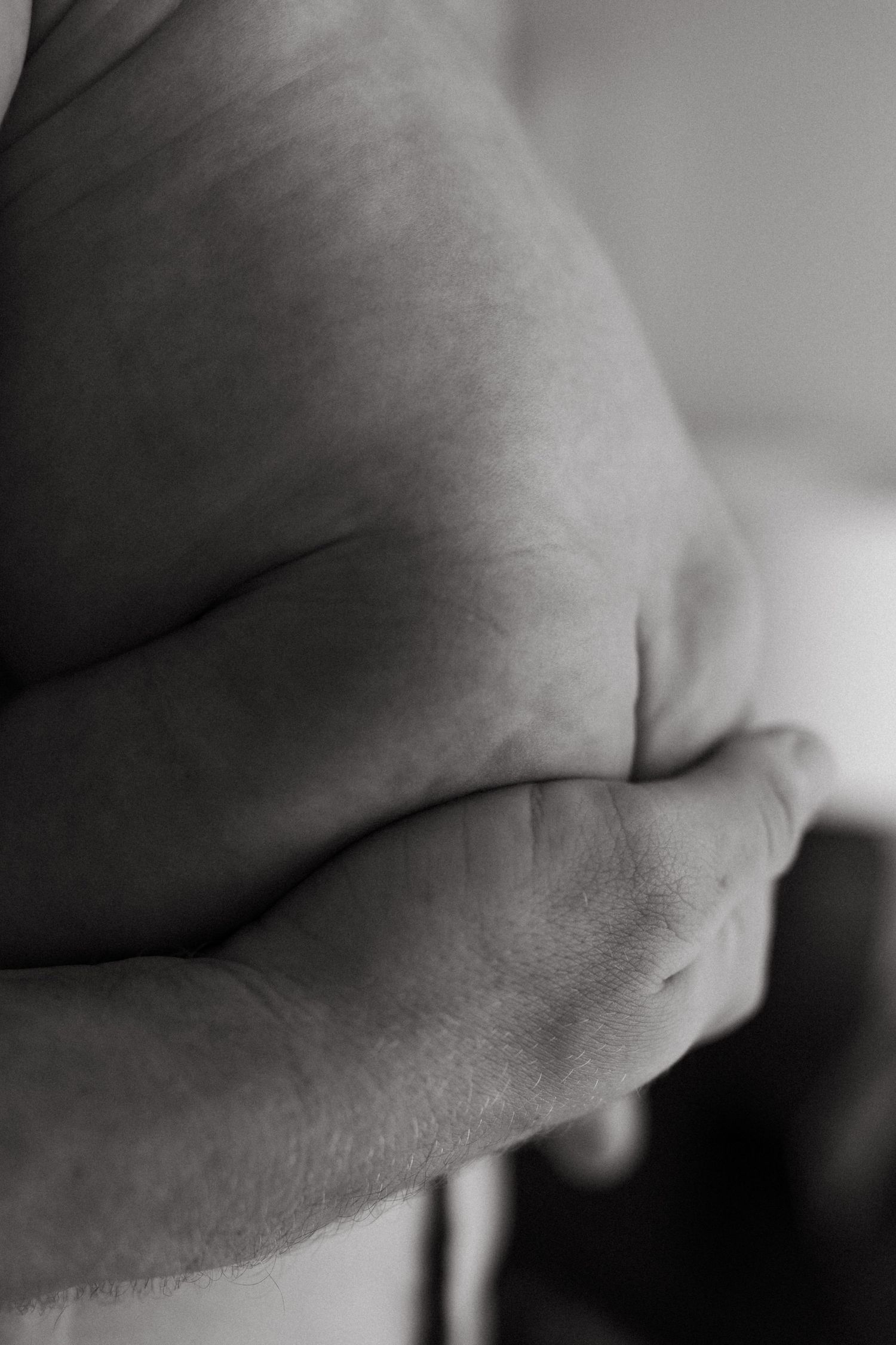 Abstract black and white close-up series showing gentle curves and shadows.