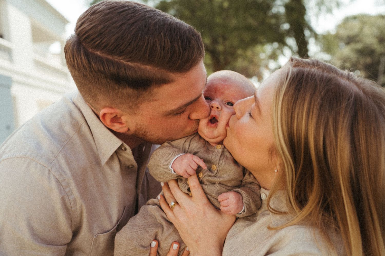 Intimate outdoor portrait of couple sharing a tender moment.