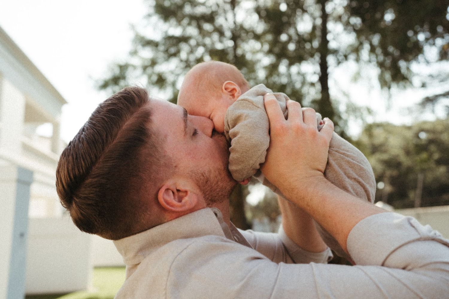 Parent playing with baby outdoors in a series of candid shots.
