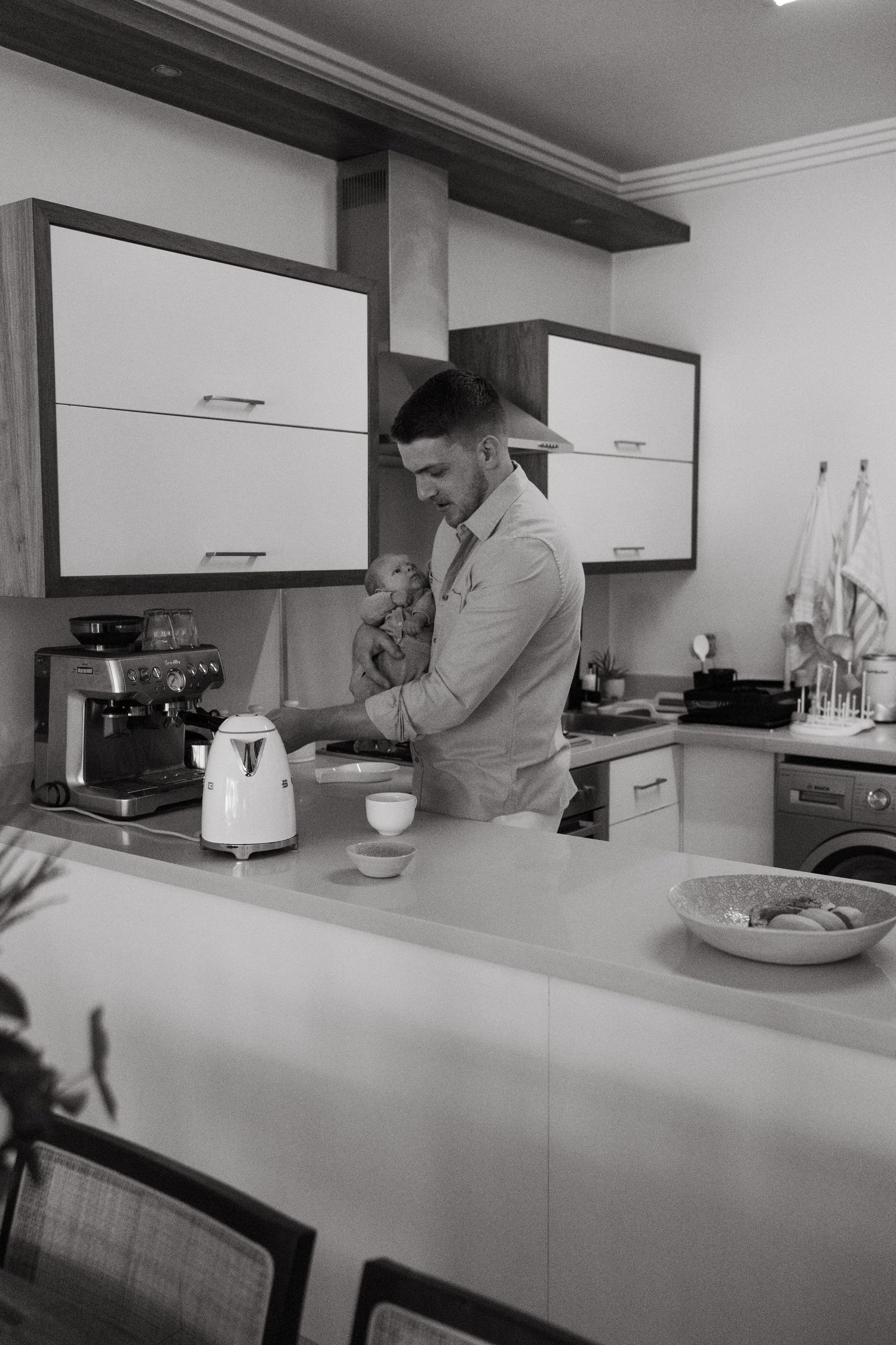 Modern kitchen interior with white cabinets and minimal decor.