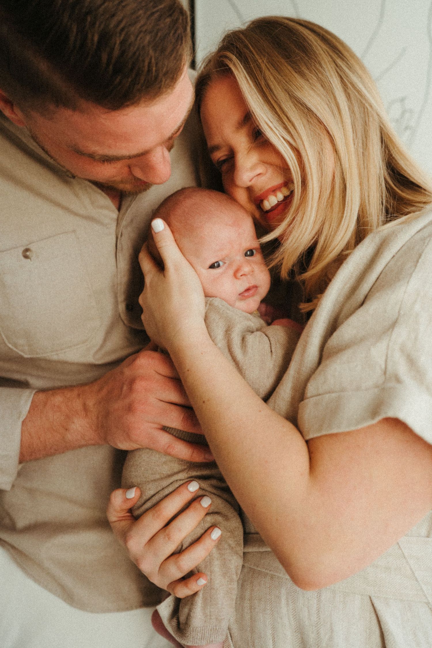 Candid family photoshoot capturing playful and intimate moments together.