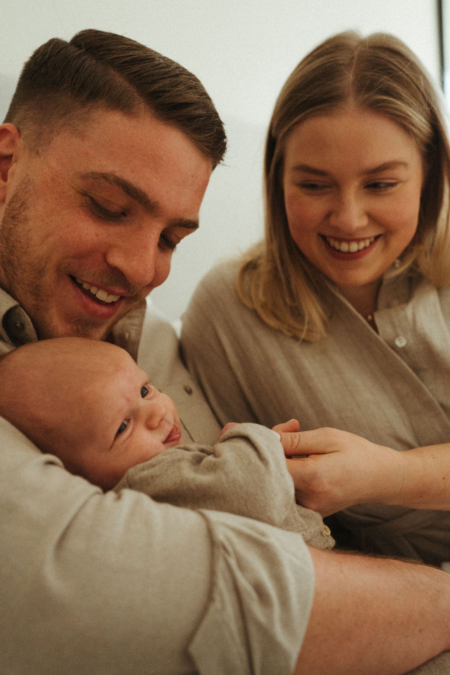 Candid family photography showing joyful expressions and genuine connection.