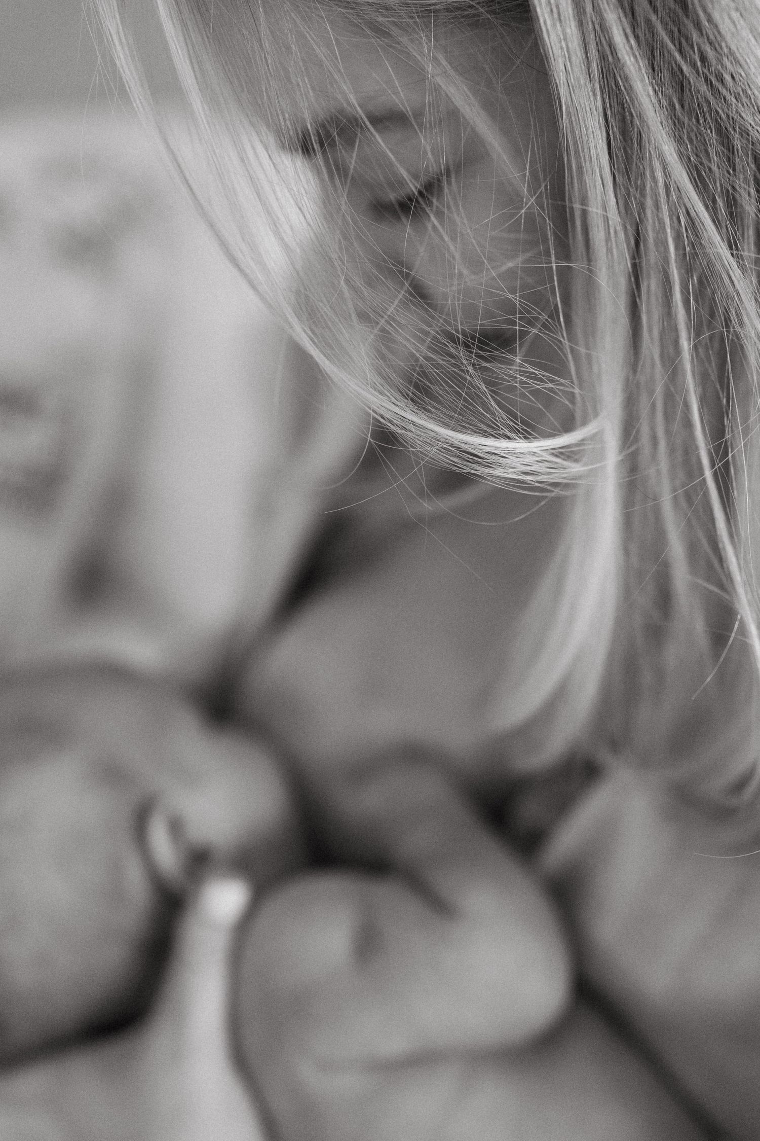 Artistic black and white close-up of nurturing moment.