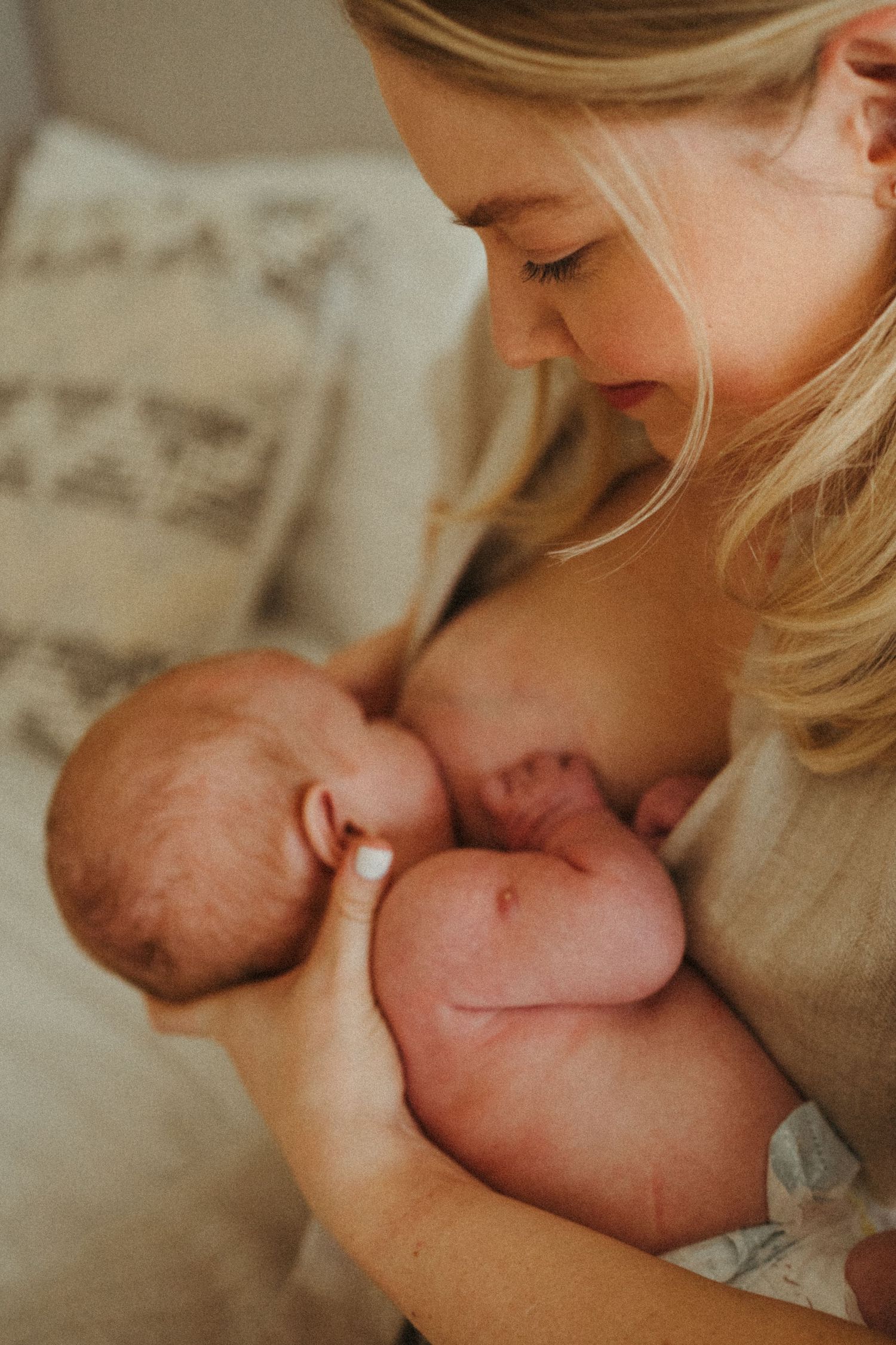 Close-up portrait of tender newborn care moment.