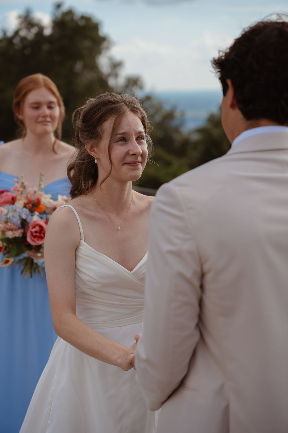 Elegant outdoor wedding ceremony with soft lighting and romantic moments between the couple.