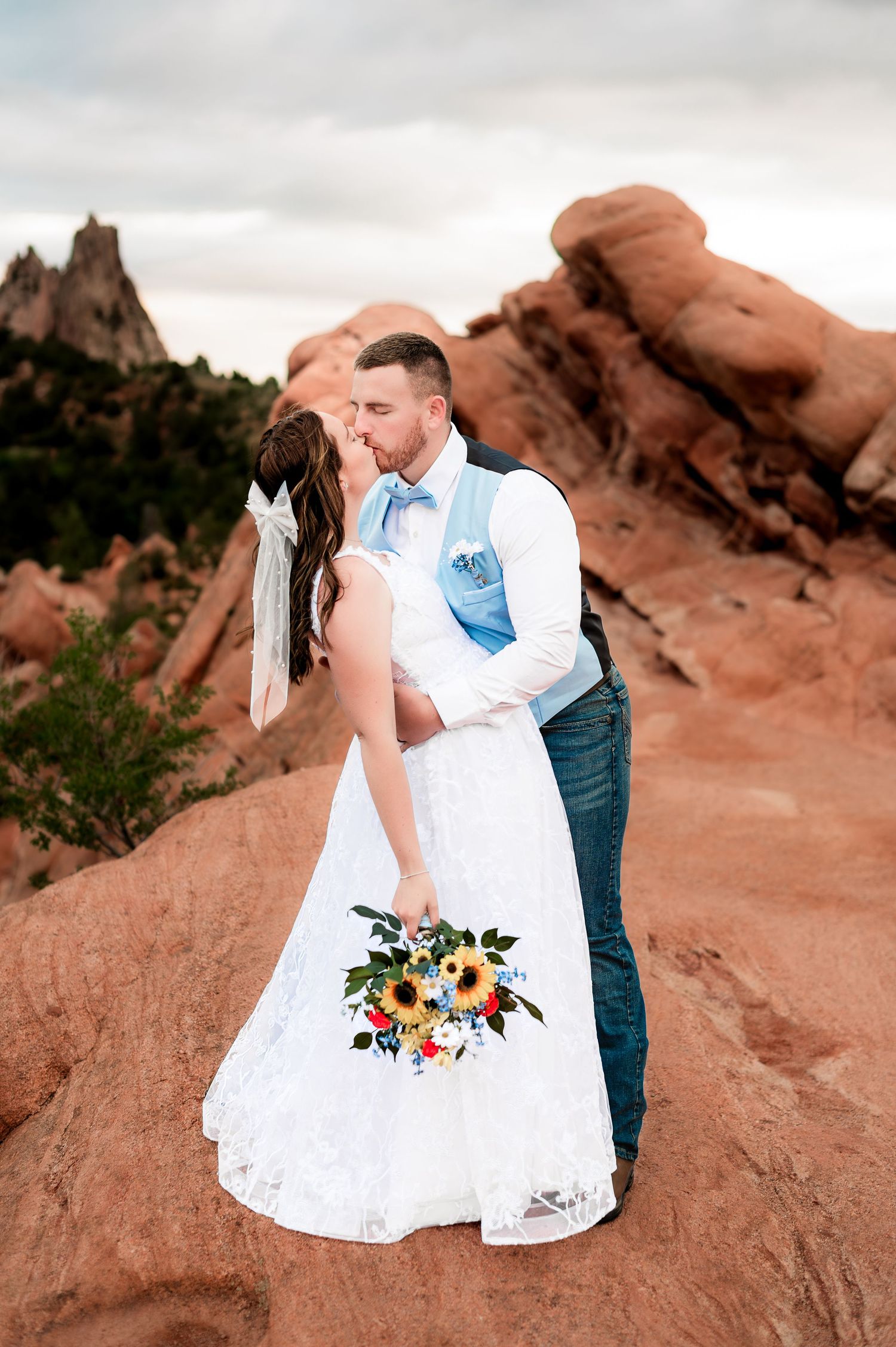Romantic wedding portraits captured at sunset among the stunning red rocks at Garden of the Gods in Colorado.