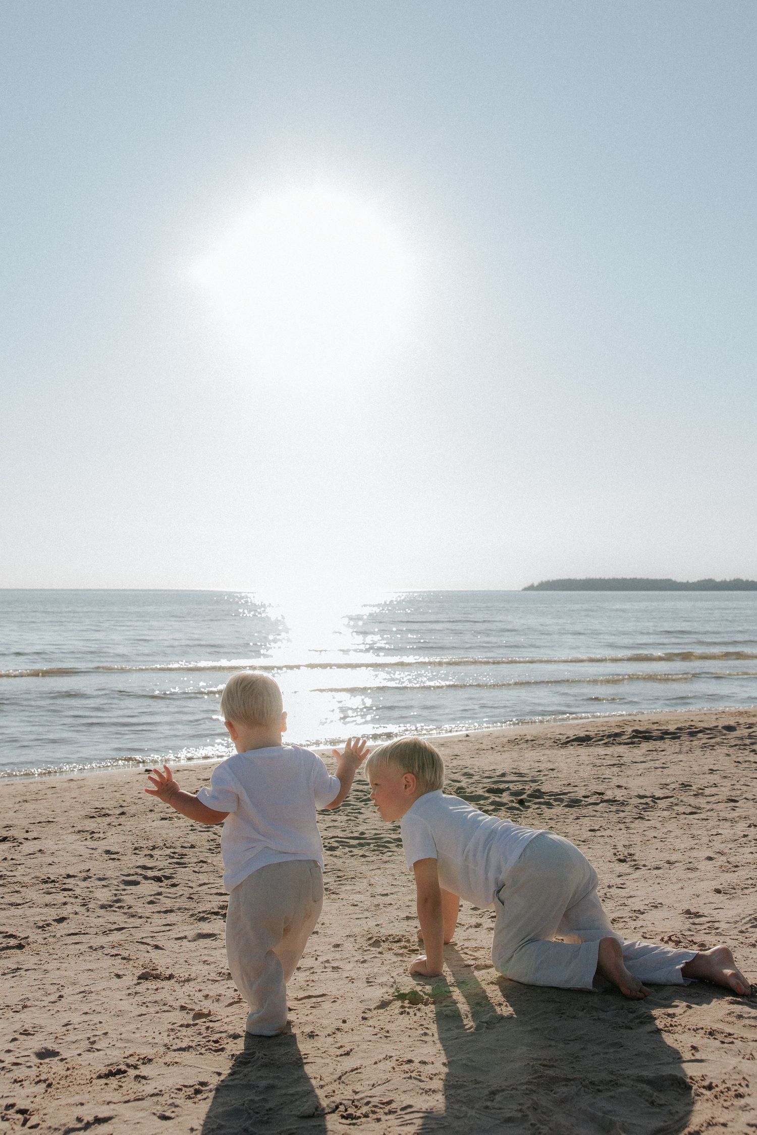Tender moment captured between parent and baby in soft natural lighting.