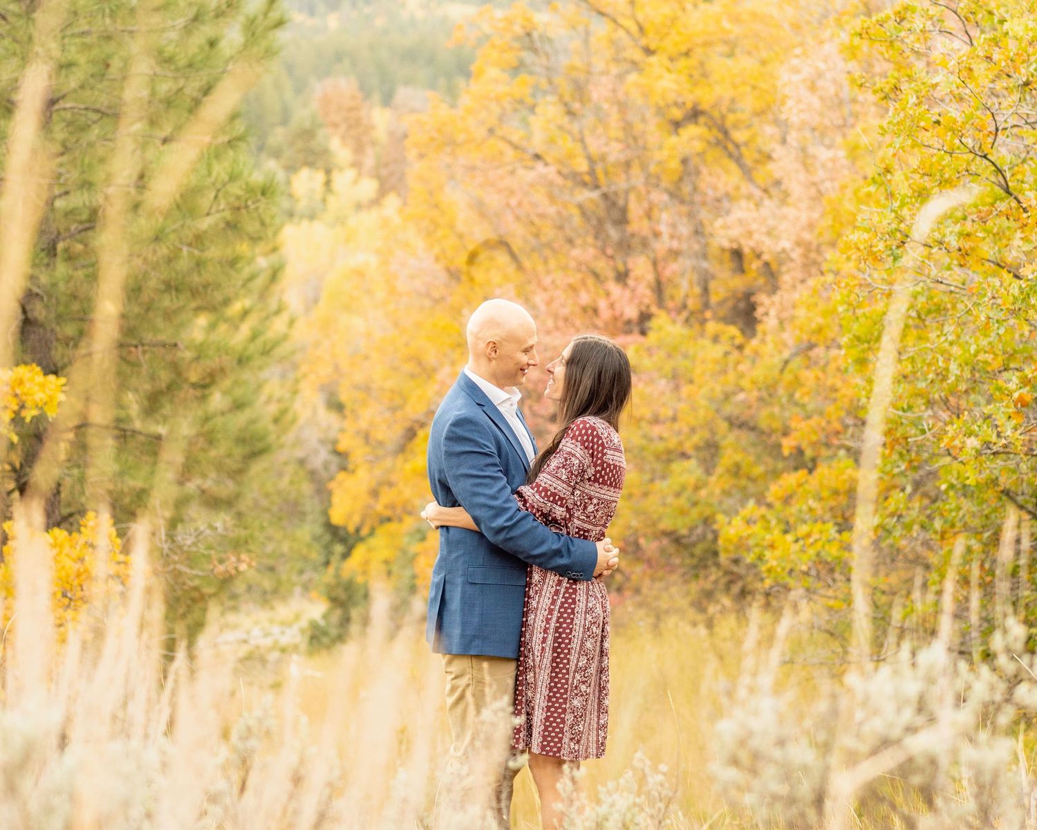 True to color photo of family dressed in pastel colors.