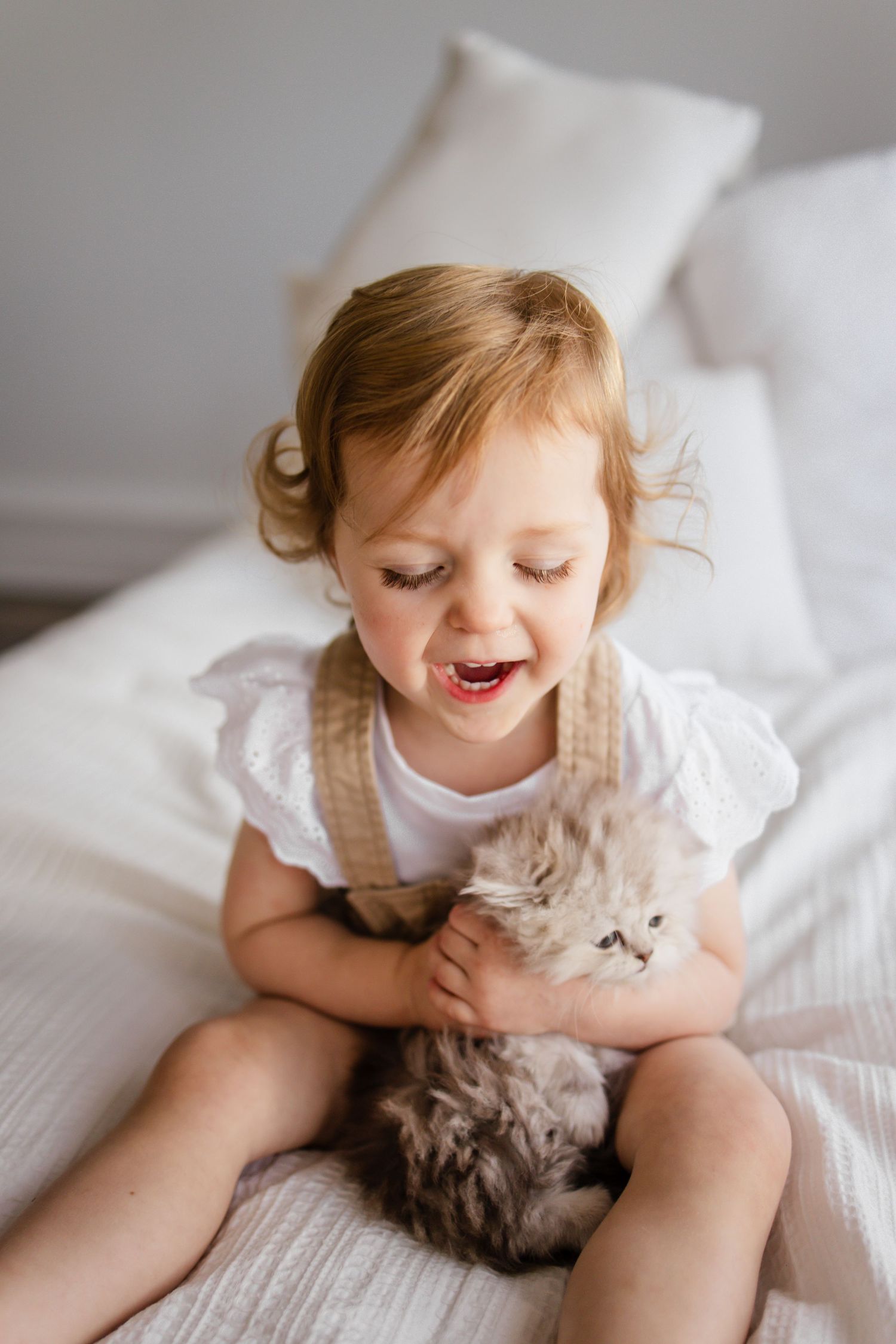Little girl and kitten at studio on the alley in Zionsville, Indiana