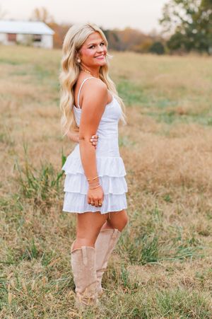 High school senior girl posing in a field, natural light senior session Tyrone GA