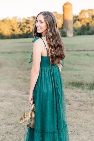 Senior girl posing in a field with silo in background, senior session Sharpsburg GA
