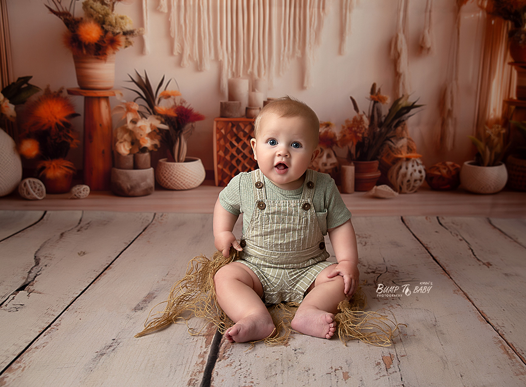 Professional sitter baby photography session in a Croydon Melbourne studio, capturing a baby sitting confidently at the 6–9 month milestone
