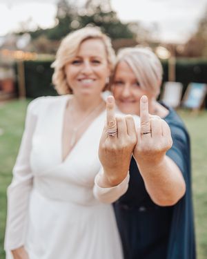 Playful wedding photo series showing couple giving middle finger gestures while smiling and laughing.