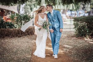 Close-up shots of white wedding dress and denim jacket details in outdoor garden setting.
