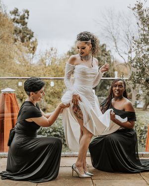 A sequence of playful wedding photos showing someone in black sitting while another person in white dances nearby.