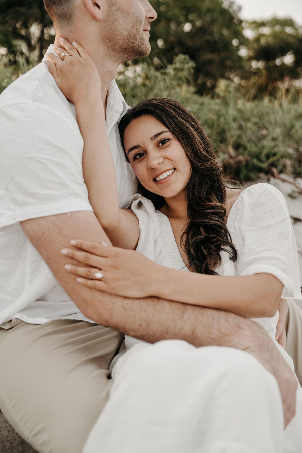 An intimate beach photoshoot with soft natural lighting.
