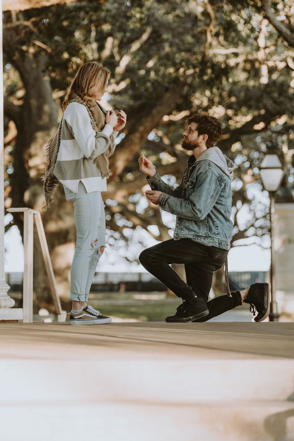 Proposal moment captured in sequence on outdoor porch with classical columns.