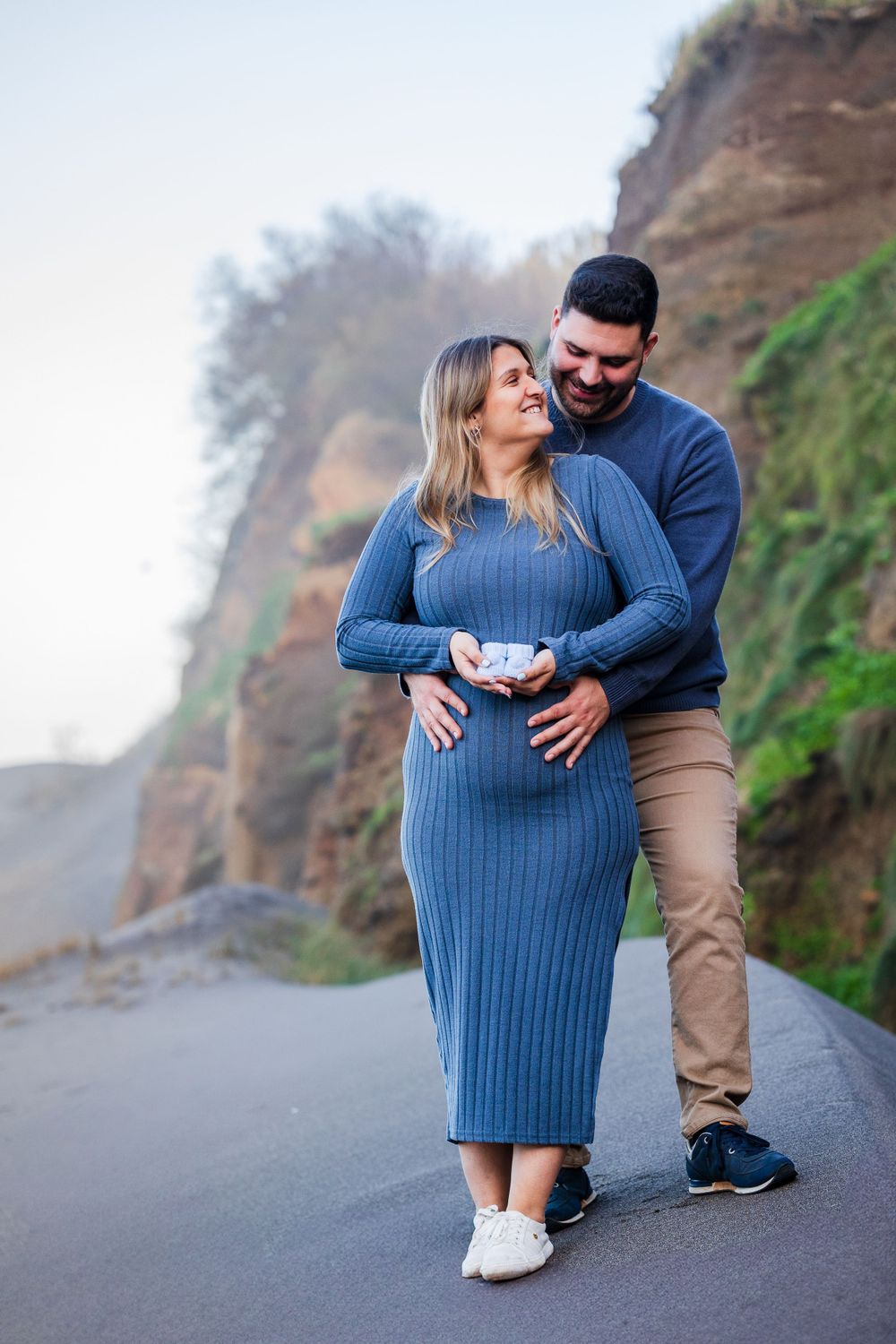Maternity photo session at a beach, at São Miguel island, Azores. Beautiful pregnant couple.