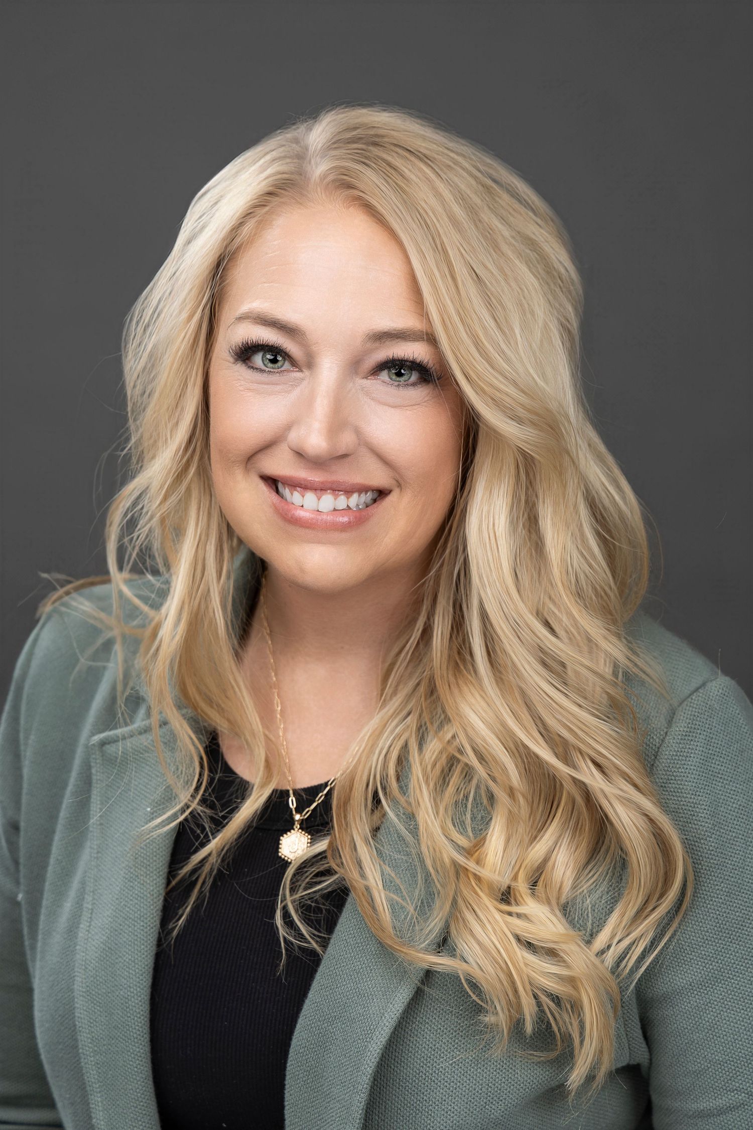 Professional headshots showing blonde woman in green cardigan against gray background.