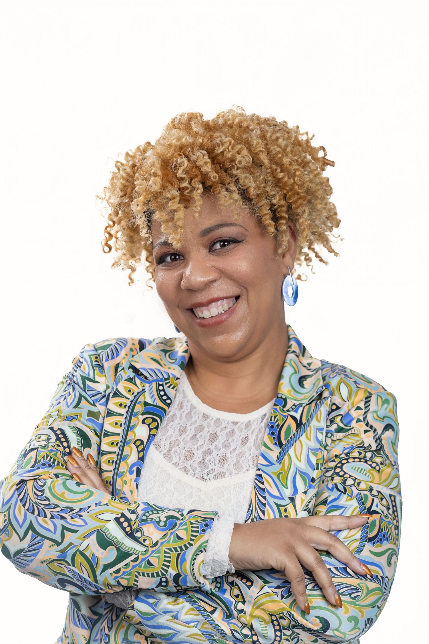 Portrait series of woman in patterned jacket and white lace top against white background.