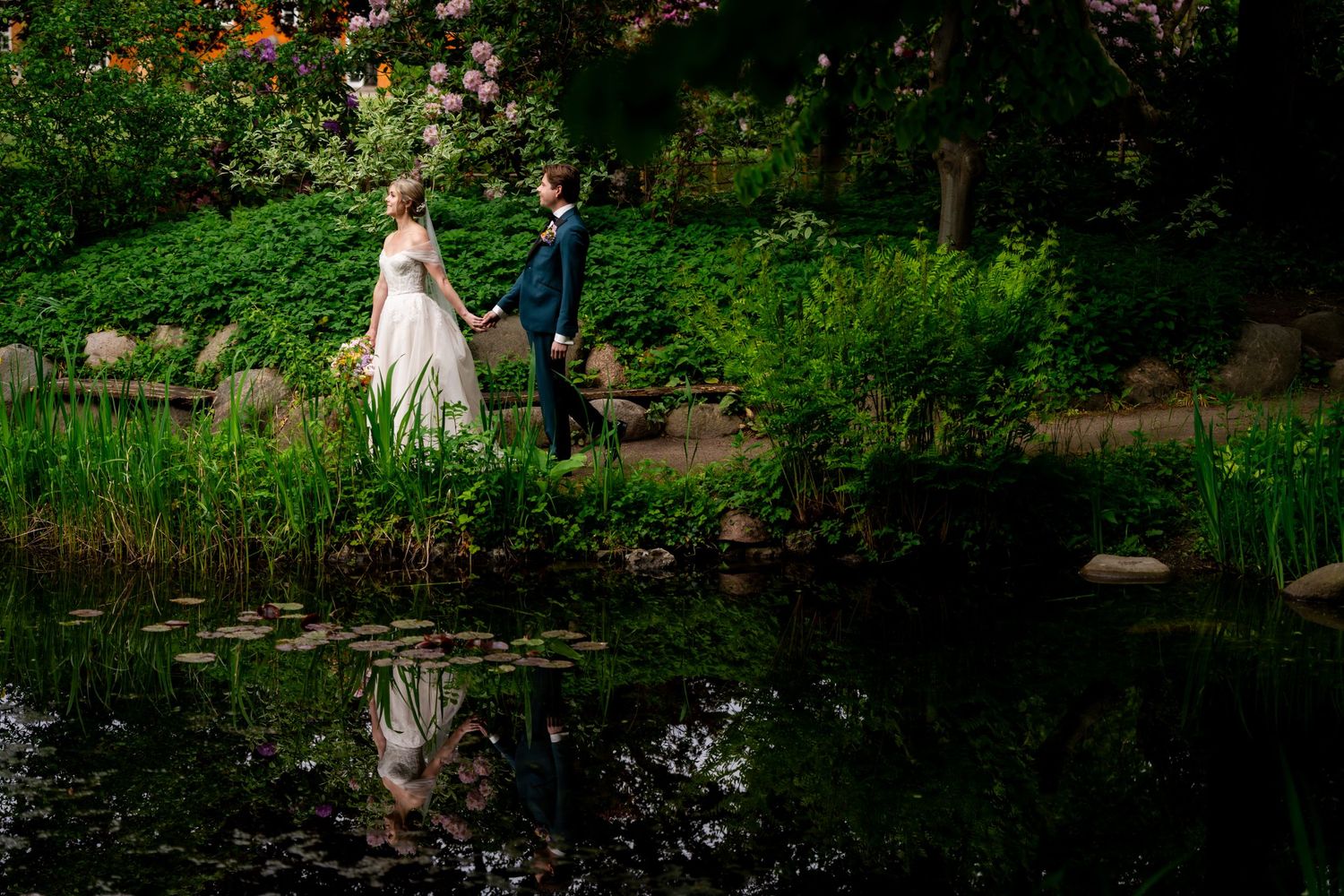 A bold and classic profile of bride and groom with an all black background shot at The Whiskey Factory Detroit