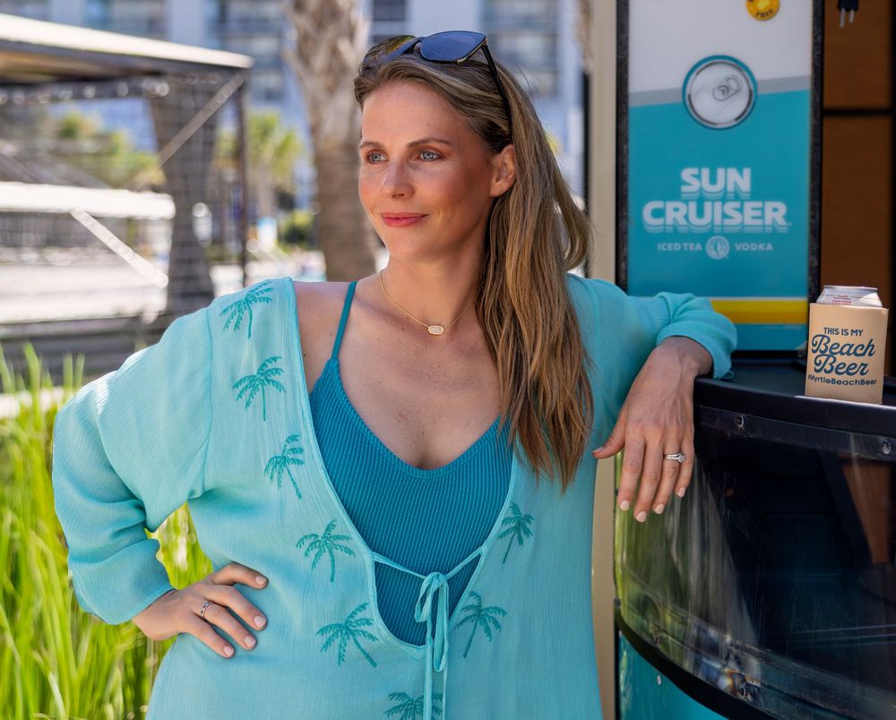 Lifestyle portrait of a woman in teal at a Myrtle Beach Kingston Resort.