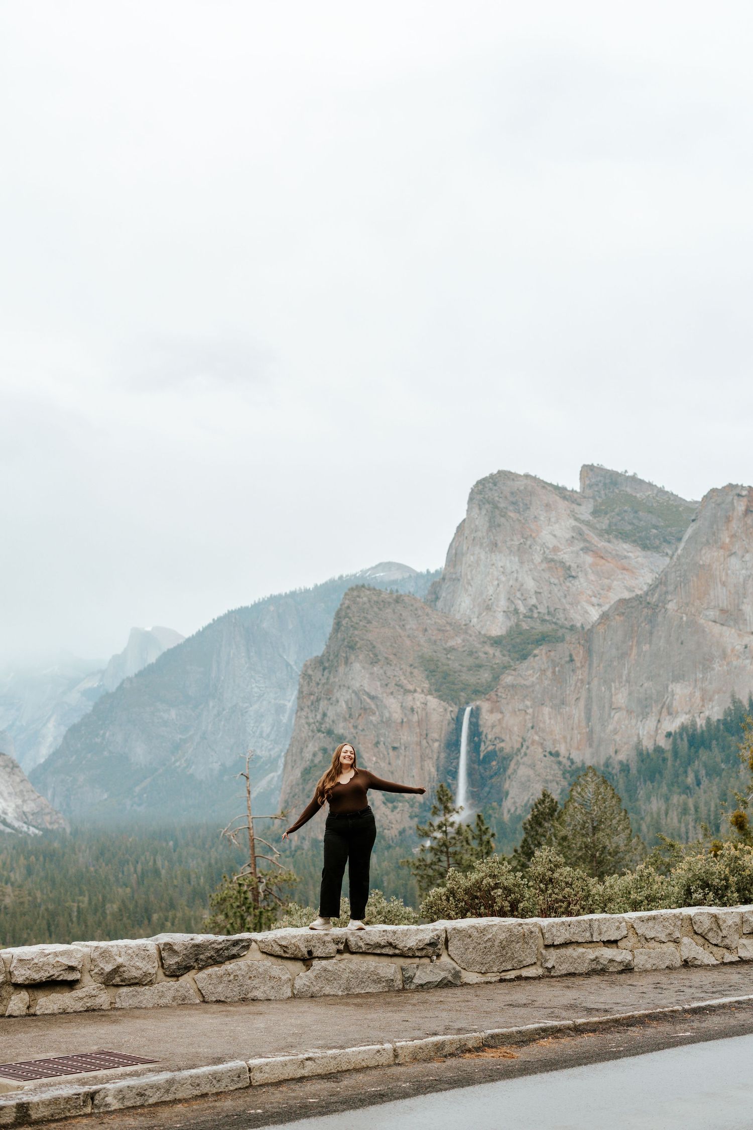 San Francisco Elopement Photographer - photographer in Big Sur holding a camera and laughing