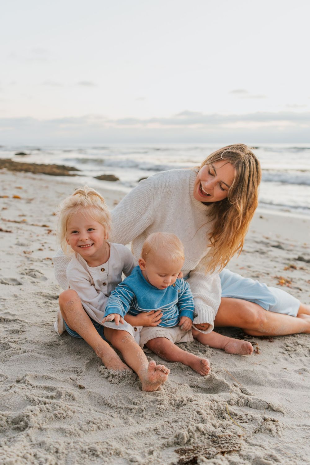Windansea Beach family photos in San Diego with playful, candid moments by the ocean.