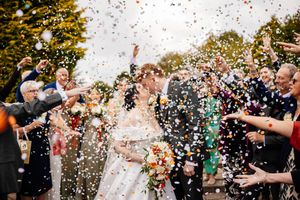 Colourful confetti tossed over a happy couple during an outdoor celebration at Mytton Fold, Clitheroe. Captured by Lynette Matthews