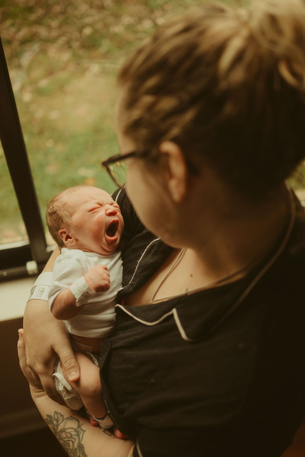 Baby girl born at Blanchfield Army Community Hospital yawns, by Clarksville fresh 48 newborn photographer Disney Magic Photography