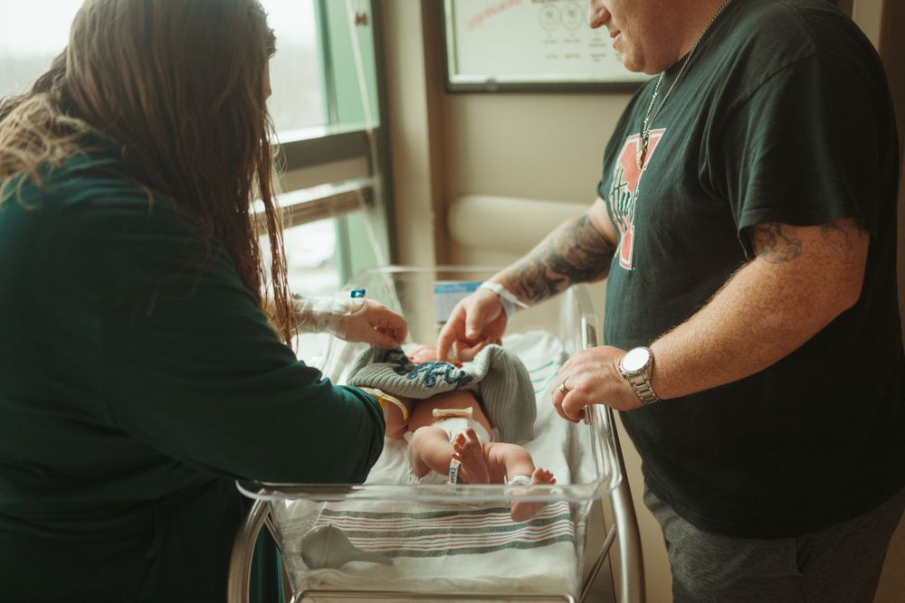 New parents welcome baby boy in Hopkinsville, Kentucky at Jennie Stuart Medical Center, by Clarksville photographer Disney Magic Photography