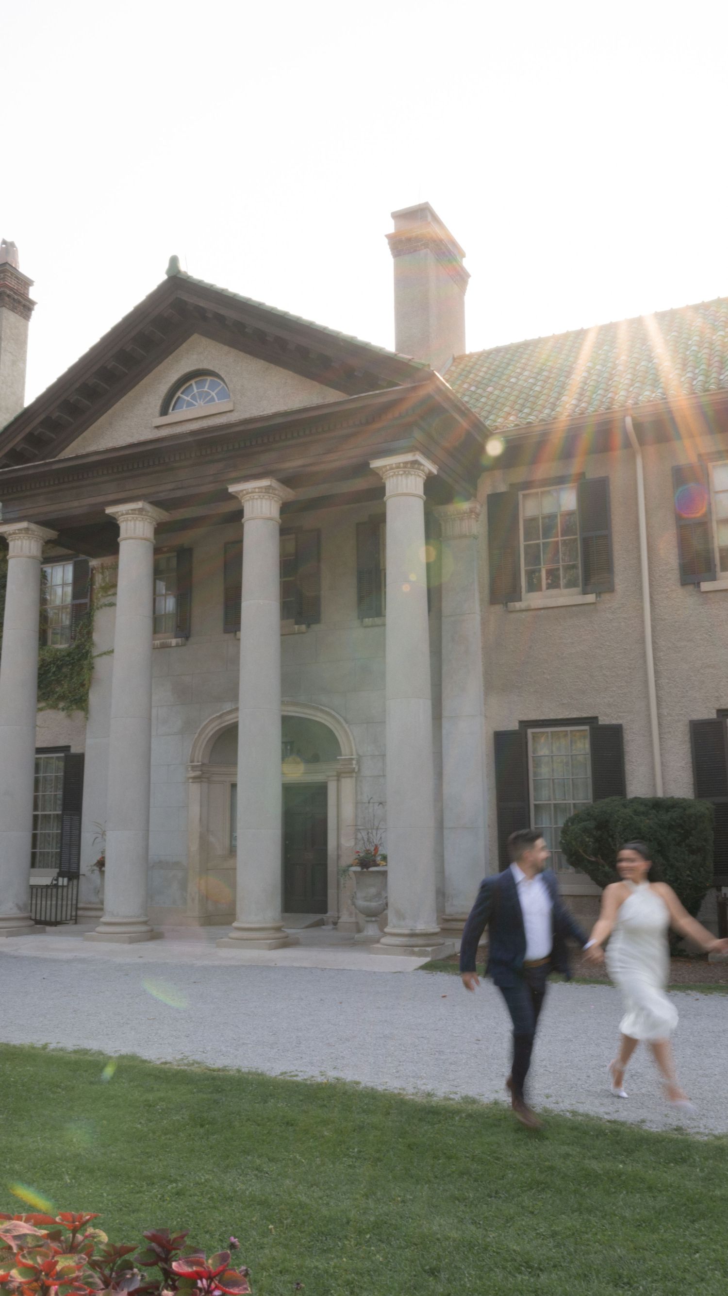 Couple running during their engagement shoot at parkwood manor