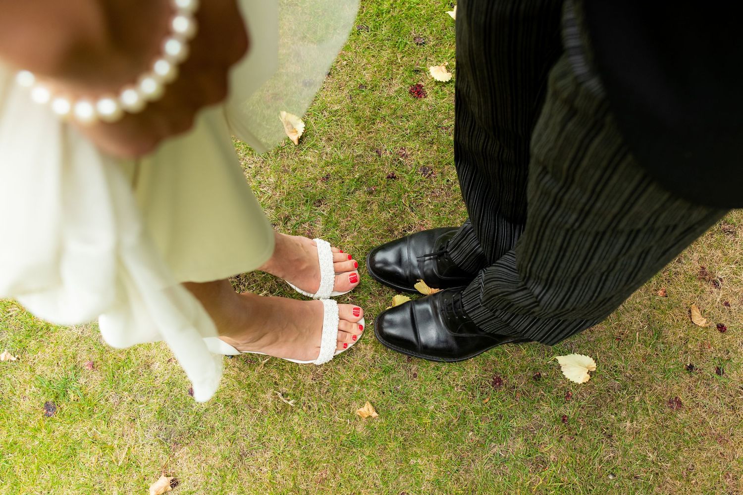 The bride and Groom's shoes are shot from above - wedding photography