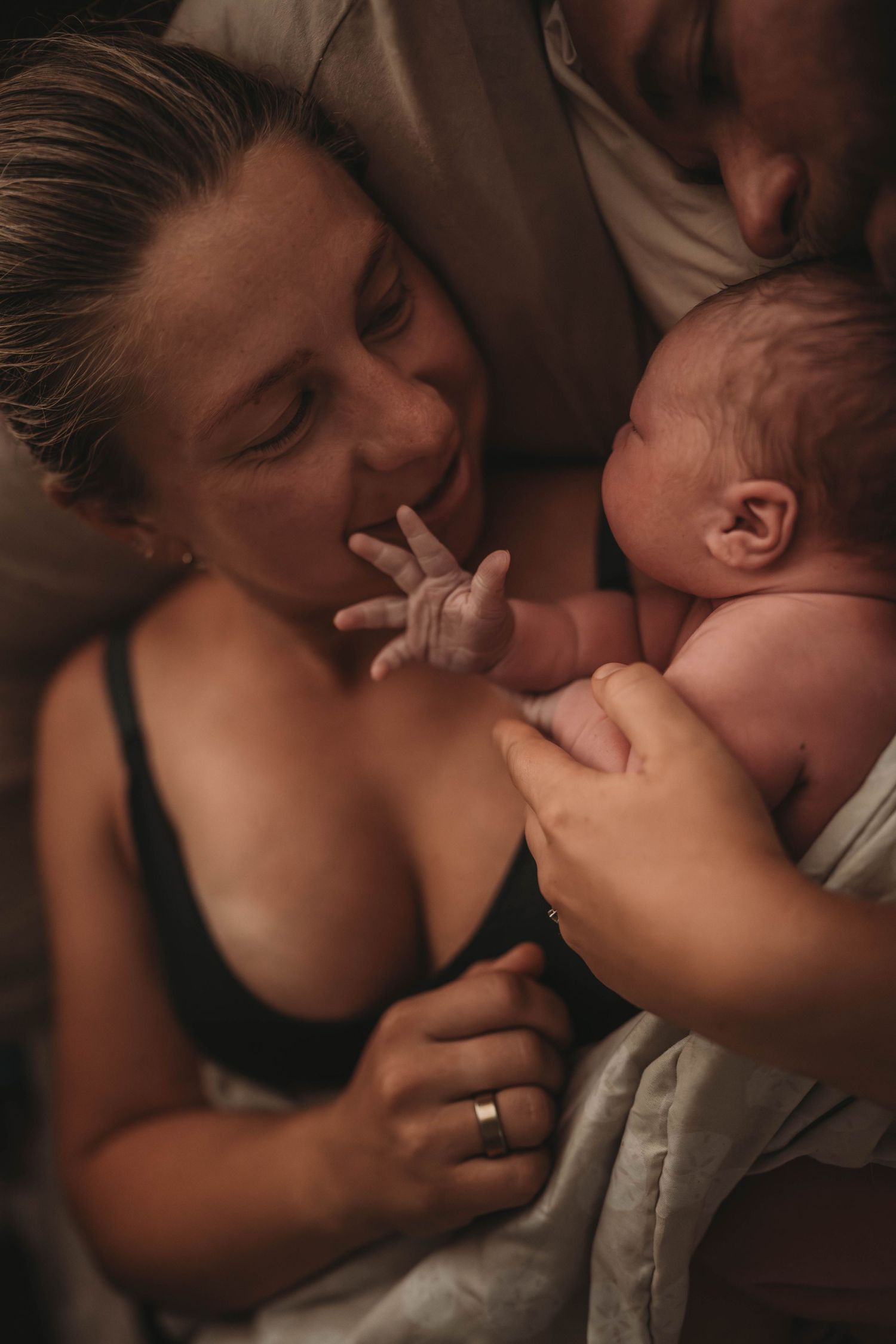 An intimate moment between a mother and newborn baby sharing skin-to-skin contact.