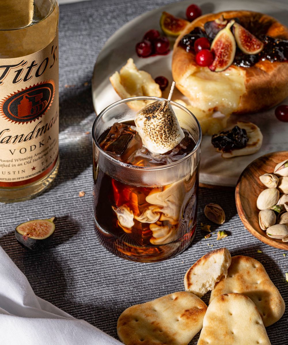 Beverage photograph of a white russian served with brie en croute captured by food and lifestyle photographer.