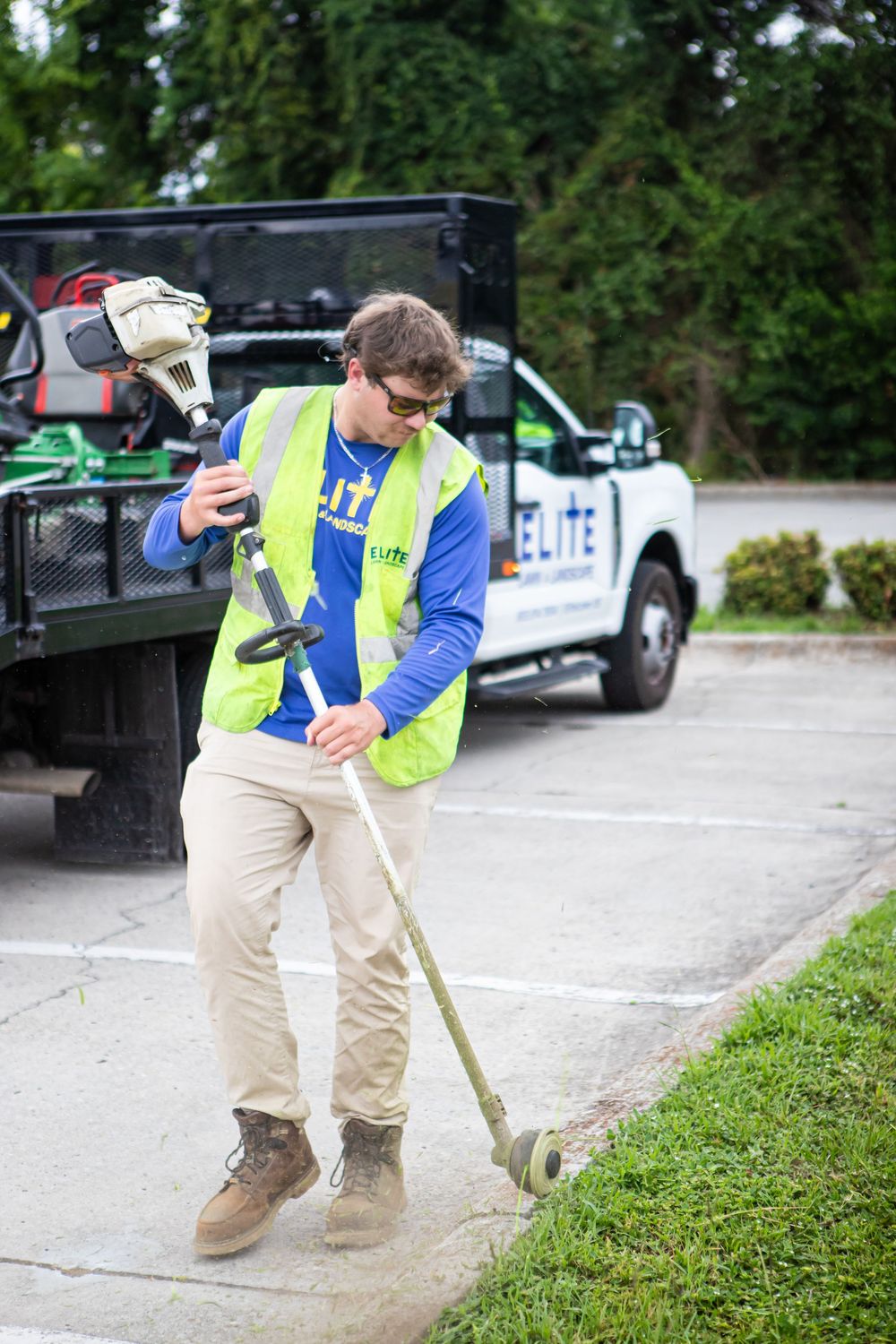 Elite Lawn & Landscape employee during a live-action branding photography session
