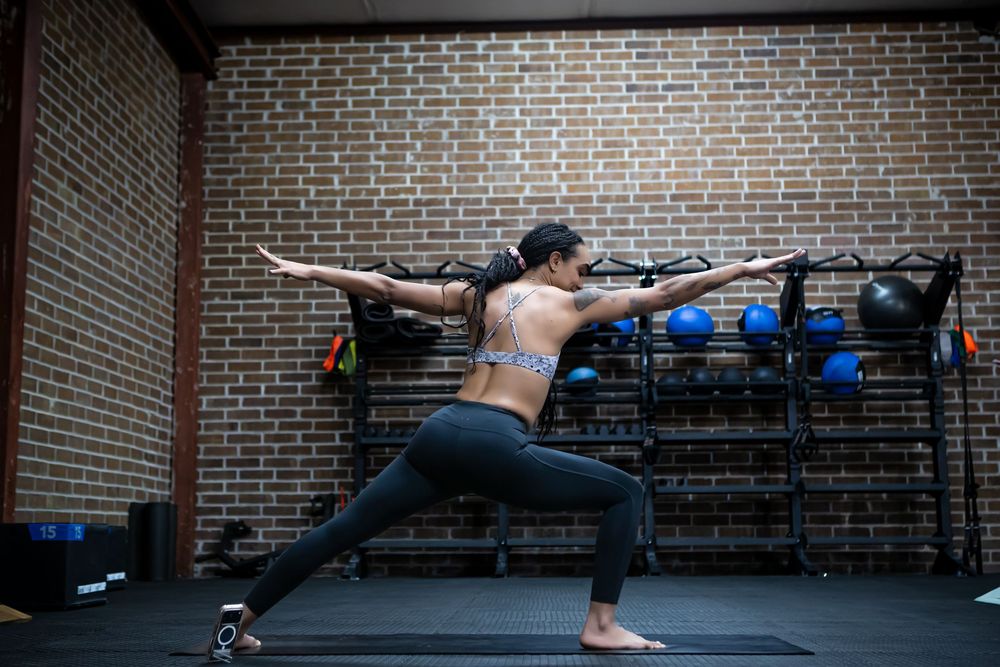 Yoga instructor from Open House Yoga demonstrating a yoga pose during a branding photography session